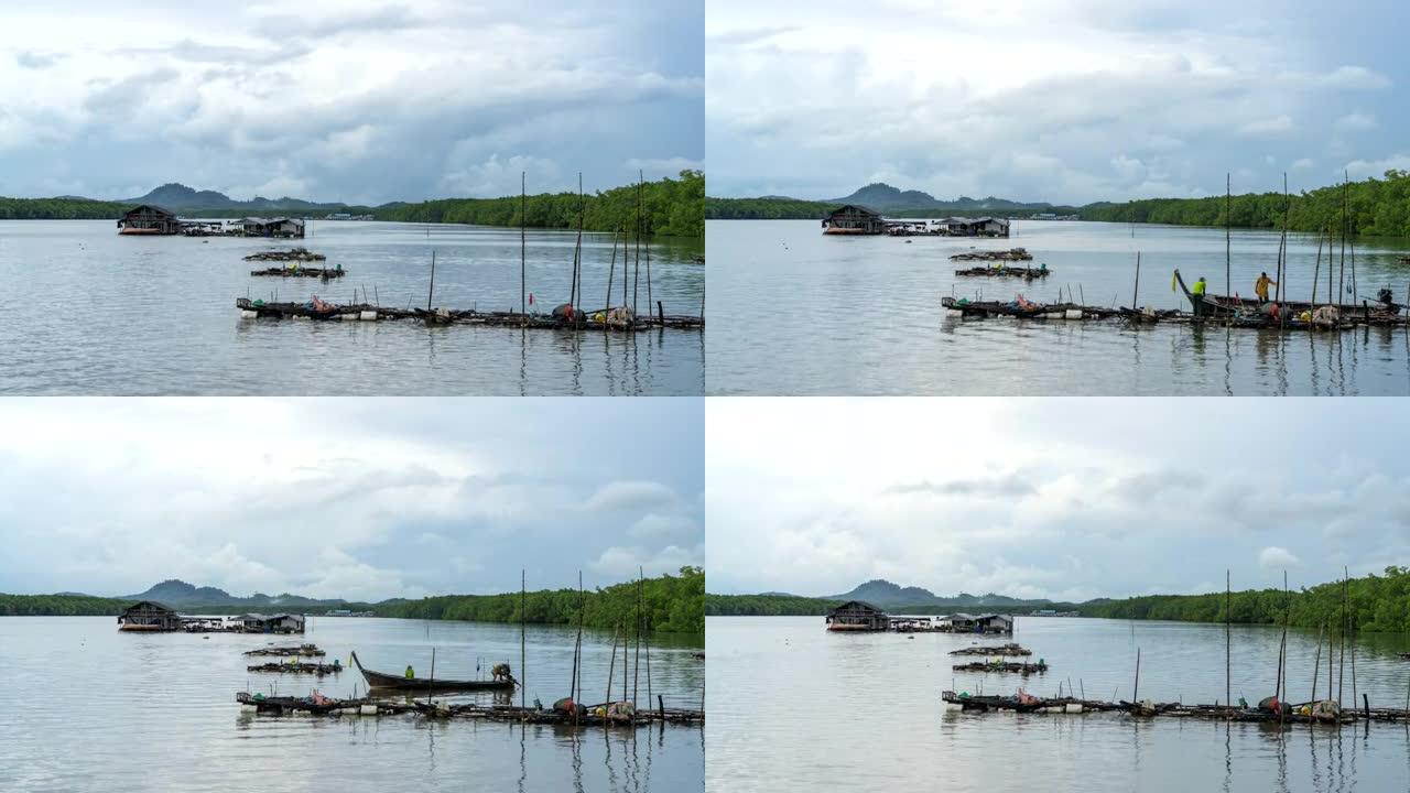 泰国攀牙府Samchongtai热带海域渔村的渔夫和木制长尾船的延时