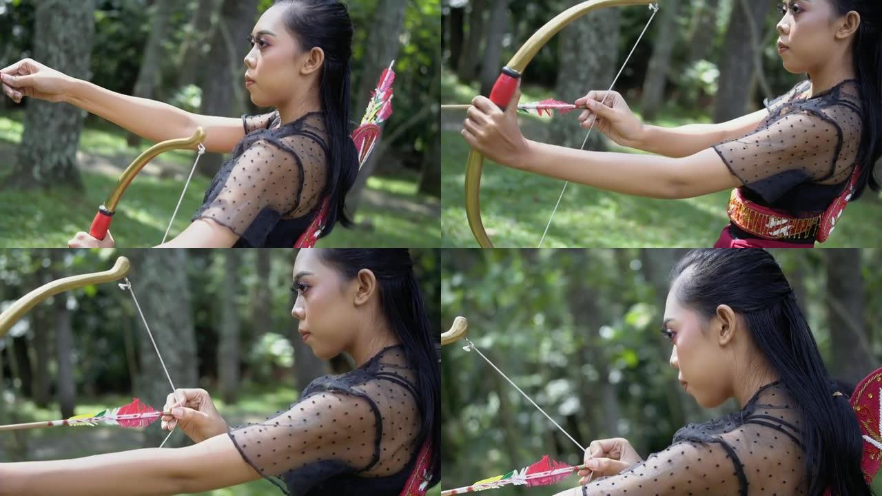 亚洲女性从后面拉箭头要放在弓上