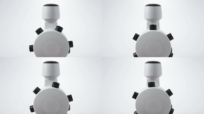在白色背景下的现代数字科学显微镜中改变变焦镜头