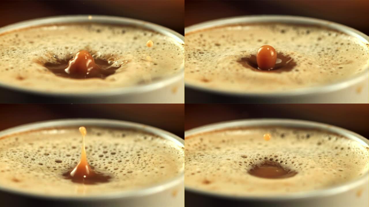 一滴泡沫掉进一杯咖啡里。拍摄的是每秒1000帧的慢动作。