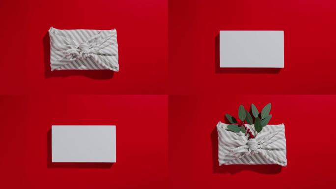 红色背景上的零浪费礼品包装传统日本furoshiki风格。圣诞节和其他节日场合的无塑料手工礼包。停止