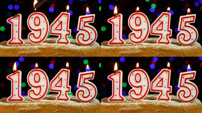 生日蛋糕与白色燃烧的蜡烛在数字1945的形式