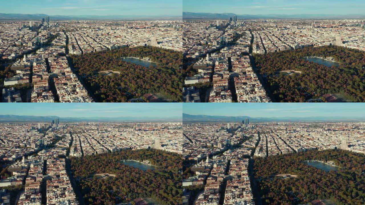 大型大都市的空中全景镜头。街区被街道隔开。大绿色El Retiro公园，有景点和水面