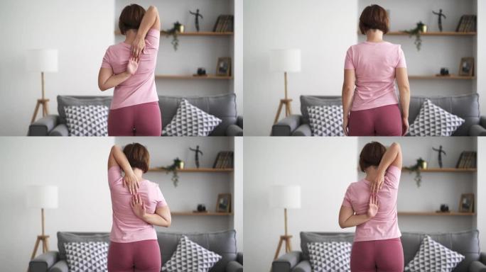 背痛，背痛的女人在家做运动