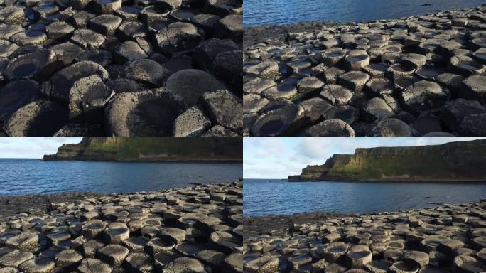 巨人的堤道位于北爱尔兰安特里姆郡北岸沿岸的玄武岩悬崖脚下。它由一些40,000巨大的黑色玄武岩柱组成