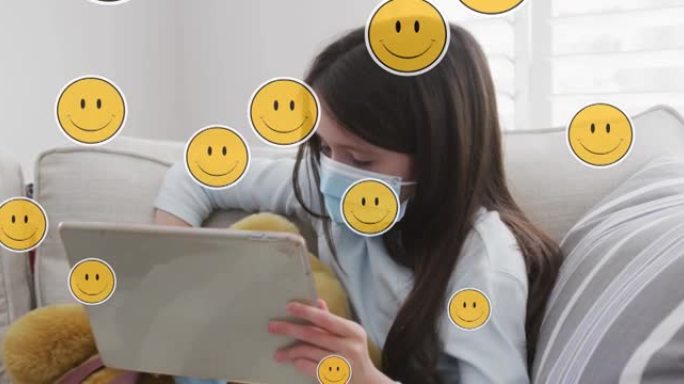 在家使用平板电脑在白人女孩脸上的数字表情图标动画