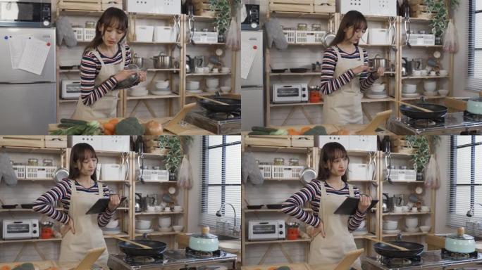亚洲家庭主妇在网上用平板电脑购物，正在寻找距离，思考在家里的厨房里买什么食材。