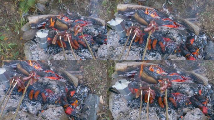 4k视频，用柴火在田野里做的烤肉锅，周围是岩石