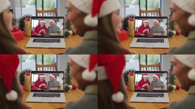 快乐的高加索高级男子和孙女在圣诞节与高级朋友进行视频通话