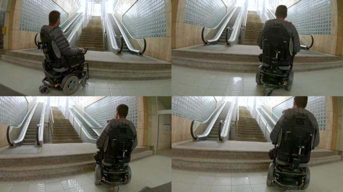 坐在轮椅上的男人看着移动的楼梯