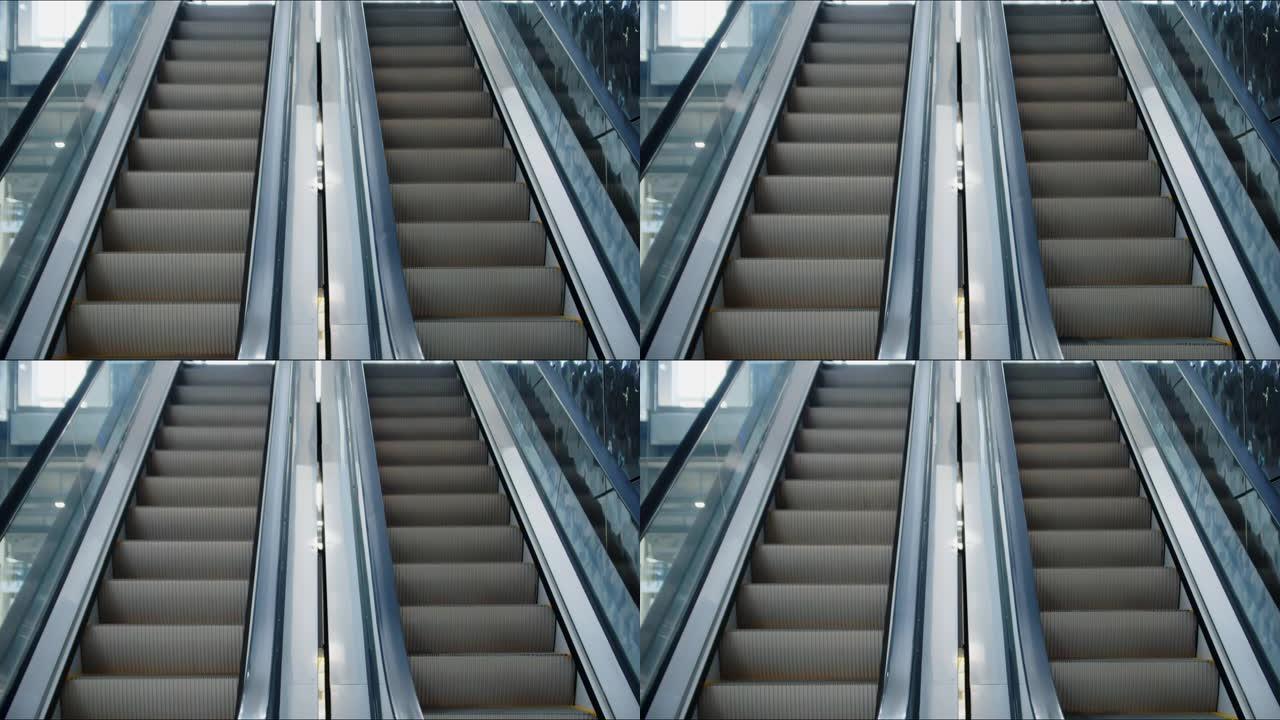 两排自动扶梯的前视图，双向前进，人向上走