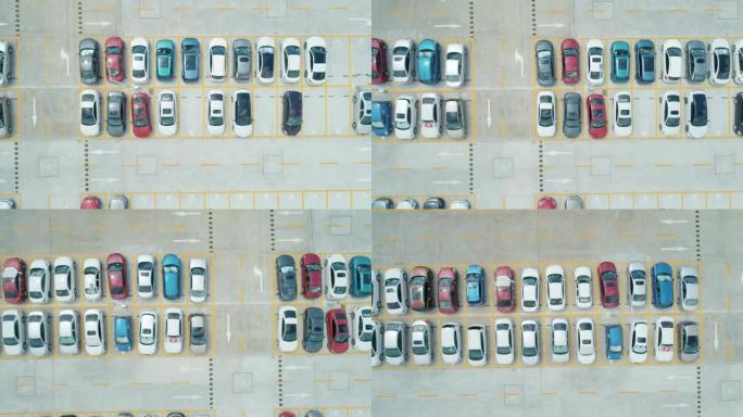空中俯视图停车场有不同颜色的汽车。相机向右移动