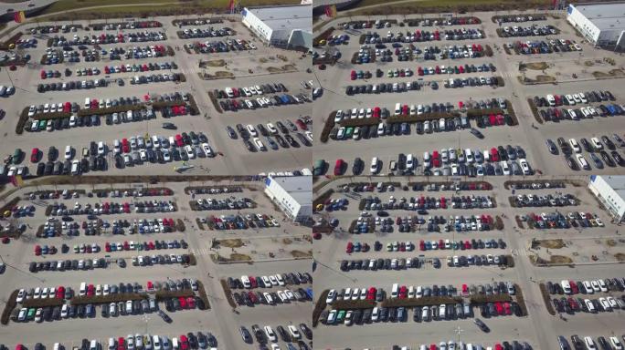 停车场或汽车经销商市场上许多汽车的俯视图。