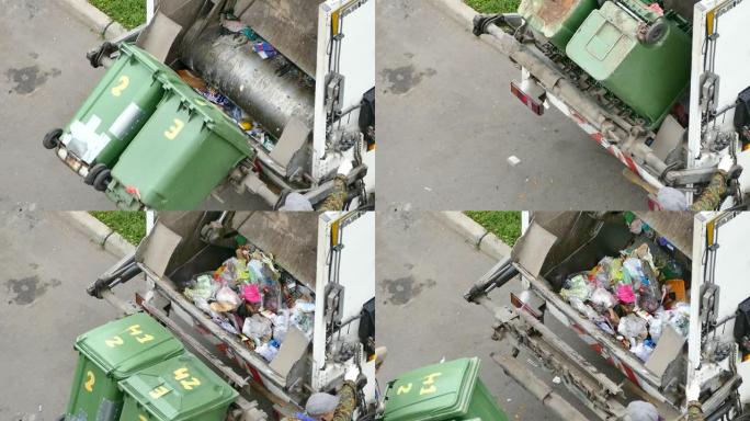 工人收集混合垃圾操作垃圾车，库存镜头，莫斯科，14 9月2021日