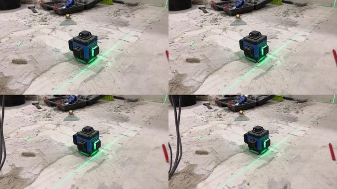 激光水平仪将绿线投射到水泥地板上