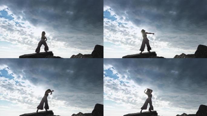 跳舞的女人剪影自由能量悬崖天空