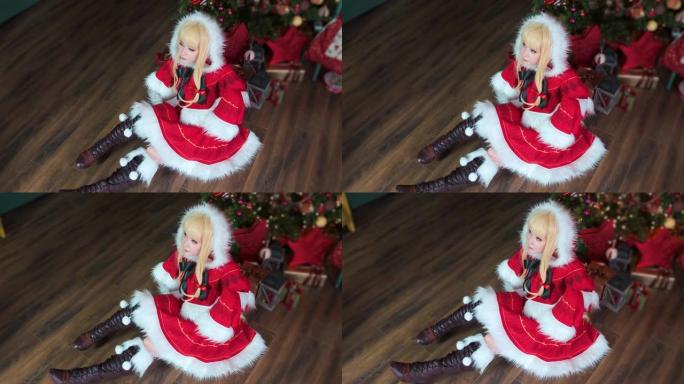 可爱的女孩角色扮演圣诞米库圣诞老人礼服与礼物。新年精灵。坐在地板上。