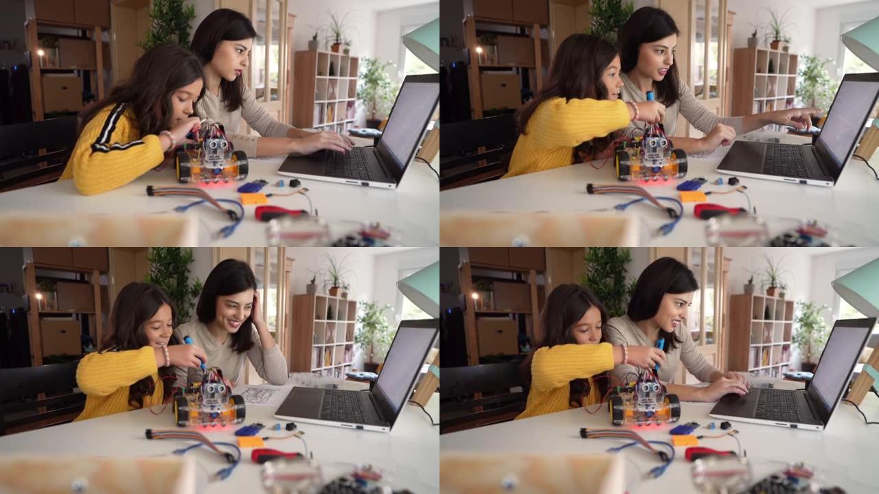女计算机程序员，在一起制作机器人汽车的同时，对女儿进行STEM领域的教育和学习。