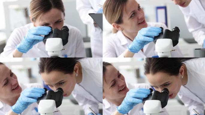 女性生物学家在实验室4k电影中通过显微镜观察