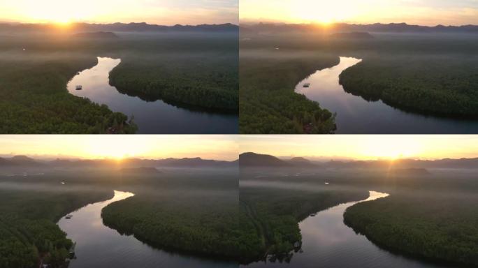泰国沙敦省日出风光时，空中无人机在红树林福雷斯特运河上方飞行