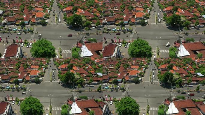 晴天巴厘岛飞越城镇交通街十字路口空中全景4k印度尼西亚