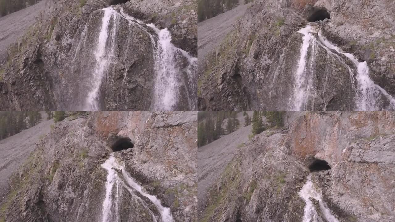 水从悬崖面上的洞口流出