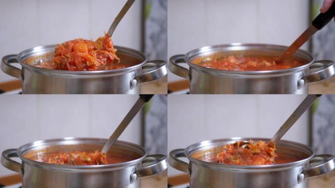 在家庭厨房的平底锅中从肉，甜菜中准备丰富，浓稠的红色罗宋汤