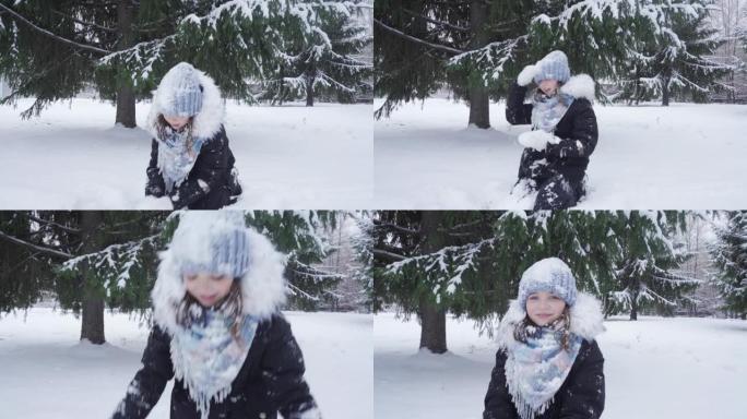十几岁的女孩在公园玩耍时扔新鲜的雪。