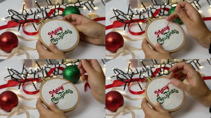 女人-制作手工圣诞刺绣。圣诞快乐木箍刺绣作为家庭或圣诞树的装饰。工艺品，假期。