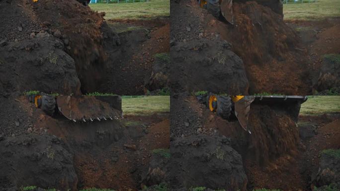 农村的土方工程。现代推土机在建筑工地掩埋沟槽