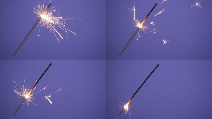 在紫色或紫色背景上关闭明亮燃烧的烟火横幅。圣诞快乐或新年快乐的概念。4k分辨率视频