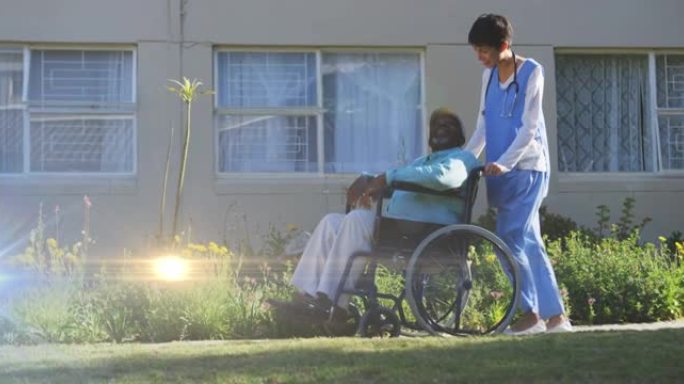 灯光在护士推着轮椅上的老人上移动的动画