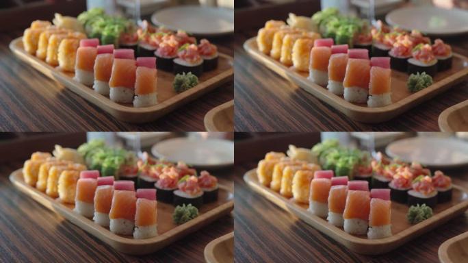 一套各种寿司卷，包括藻类，大米，诺里亚，鲑鱼，金枪鱼和费城奶酪