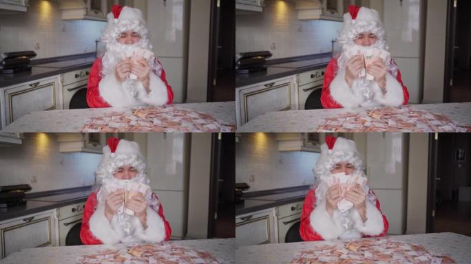 圣诞老人在厨房里在家算钱
