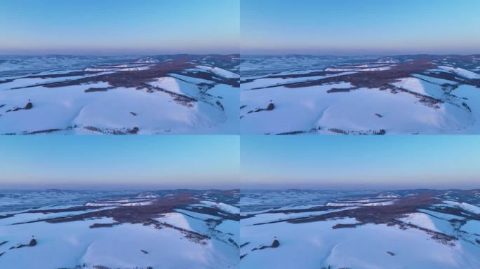 航拍内蒙古雪域雪原山峦暮色