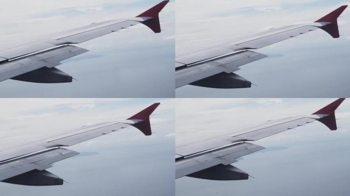 飞机的翅膀在云层上飞来飞去。