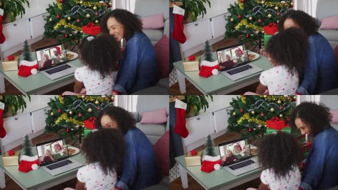 圣诞节期间，与男性朋友和儿子进行视频通话的非洲裔美国母女快乐