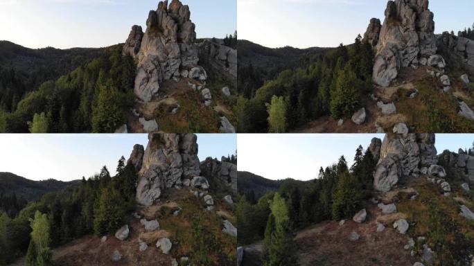 空中无人机镜头在著名的图斯坦要塞的岩石附近飞行。国家公园的乌克兰中世纪悬崖边纪念碑。图斯坦的岩石综合
