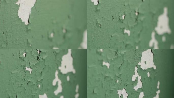 旧墙涂有绿色油漆，剥皮油漆，特写