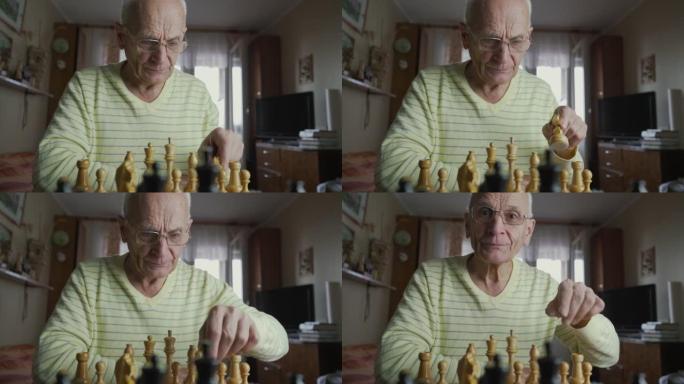 戴眼镜的白发老人在棋盘上移动主教棋子