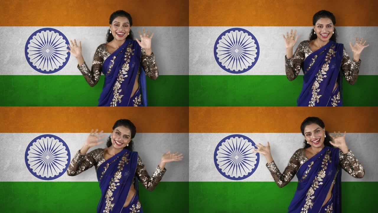女人跳舞，挥舞着印度国旗的手