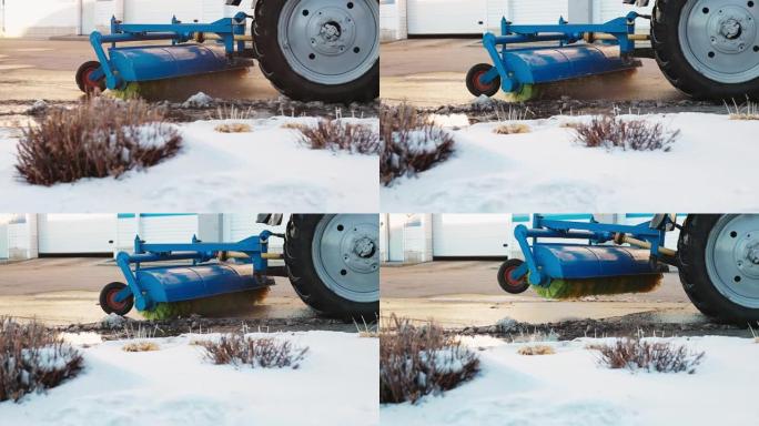 拖拉机用刷子扫除泥土和雪。清洁和清洁街道的附件