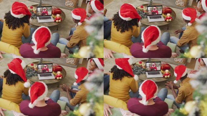 带有圣诞老人帽子的多样化家庭使用笔记本电脑进行圣诞视频通话屏幕上的圣诞老人
