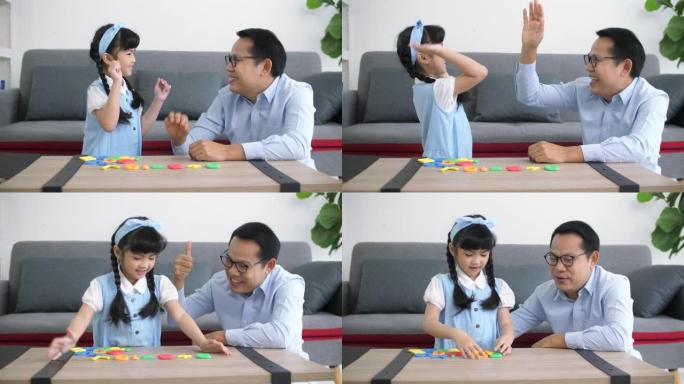 亚洲父亲给女儿玩数学游戏