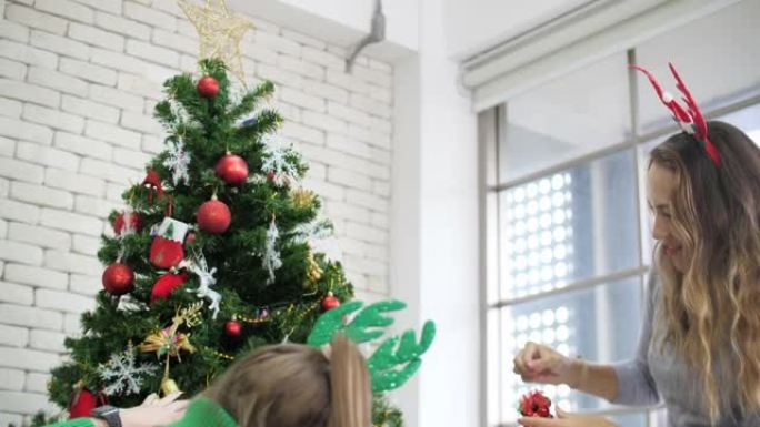 高加索女性装饰圣诞树，办公室挂饰，圣诞派对办公室概念