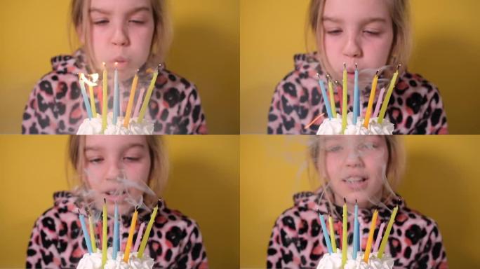穿着豹纹工作服的快乐少女在派对上吹出十支彩色蜡烛。特写女孩的脸。慢动作生日快乐视频横幅