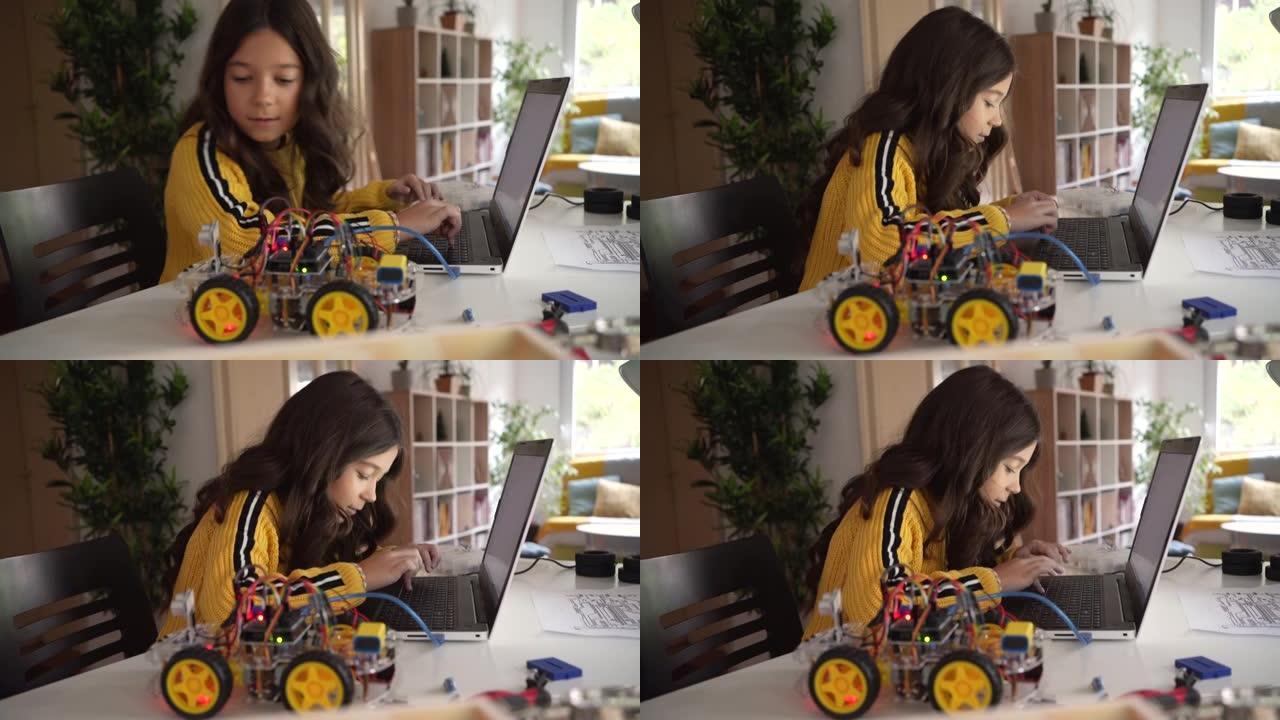 一个白人女学生在她的笔记本电脑上用Arduino平台测试她的机器人汽车原型