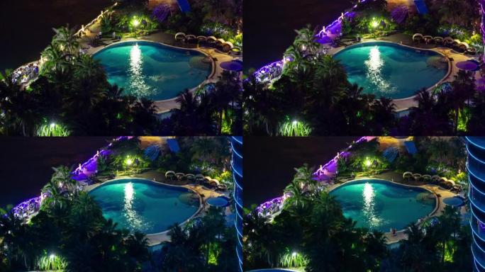 夜间照明海南岛三亚著名酒店综合游泳池全景4k延时中国