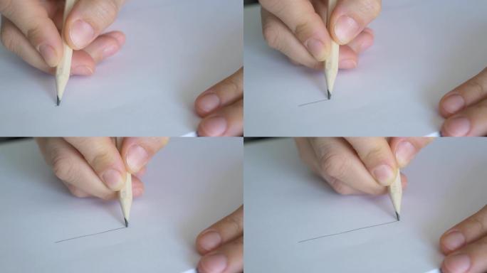 特写灰色铅笔，在纸上画线。用石墨铅笔留一条线。艺术家在纸上画素描。工程师开始绘制项目