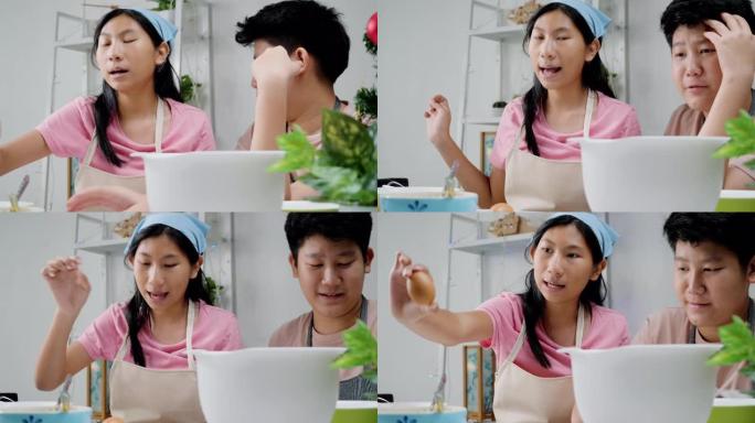 亚洲儿童在圣诞节期间在家拍摄烹饪饼干视频，以获取病毒视频或在家一起拍摄TikTok，这是新一代概念的